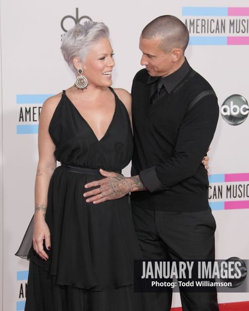 LOS ANGELES, CA - NOVEMBER 21:  Singer Pink and Carey Hart arrive at the 2010 American Music Awards held at Nokia Theatre L.A. Live on November 21, 2010 in Los Angeles, California.  (Photo by Todd Williamson/JanuaryImages)