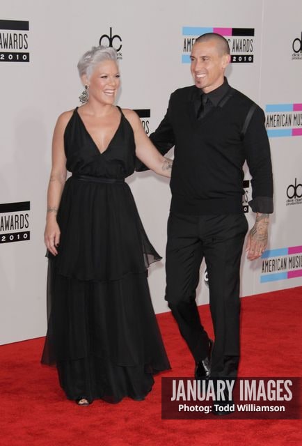 LOS ANGELES, CA - NOVEMBER 21:  Singer Pink and Carey Hart arrive at the 2010 American Music Awards held at Nokia Theatre L.A. Live on November 21, 2010 in Los Angeles, California.  (Photo by Todd Williamson/JanuaryImages)