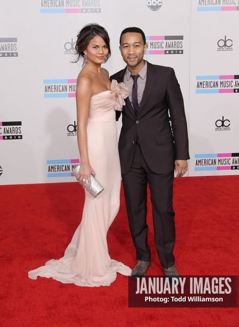 LOS ANGELES, CA - NOVEMBER 21:  Singer John Legend (right) and Christine Teigen arrive at the 2010 American Music Awards held at Nokia Theatre L.A. Live on November 21, 2010 in Los Angeles, California.  (Photo by Todd Williamson/JanuaryImages)