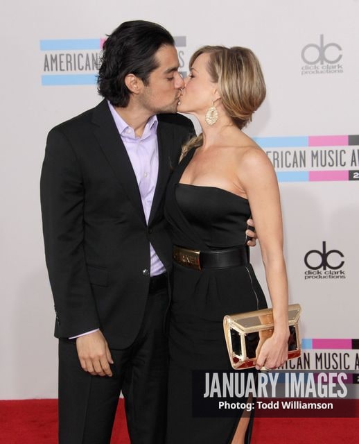 LOS ANGELES, CA - NOVEMBER 21:  Actress Julie Benz (right) and Rich Orosco arrive at the 2010 American Music Awards held at Nokia Theatre L.A. Live on November 21, 2010 in Los Angeles, California.  (Photo by Todd Williamson/JanuaryImages)