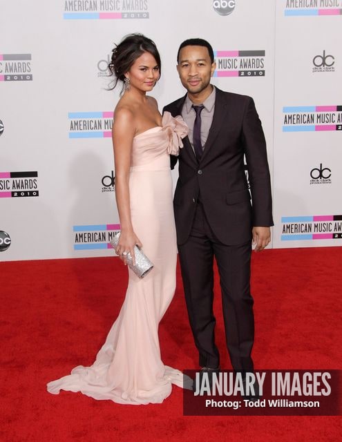 LOS ANGELES, CA - NOVEMBER 21:  Singer John Legend (right) and Christine Teigen arrive at the 2010 American Music Awards held at Nokia Theatre L.A. Live on November 21, 2010 in Los Angeles, California.  (Photo by Todd Williamson/JanuaryImages)